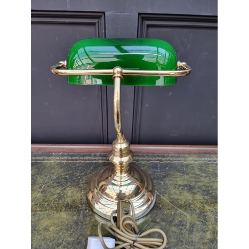 1285 - A reproduction glass and green glass desk lamp. 