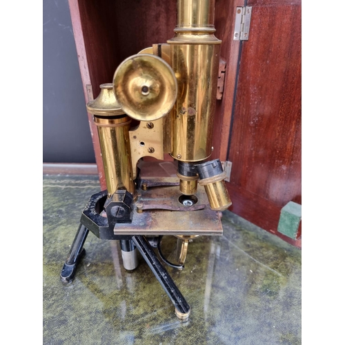 1297 - An old brass microscope, by J Swift & Sons, No.11993, in mahogany box. 