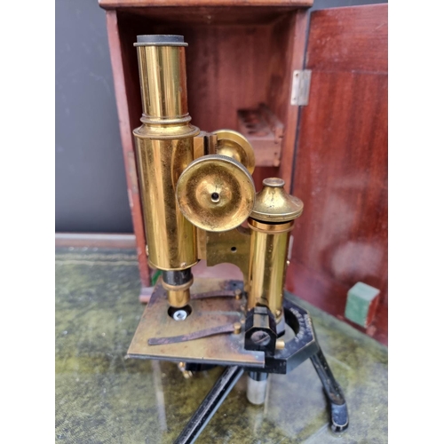 1297 - An old brass microscope, by J Swift & Sons, No.11993, in mahogany box. 