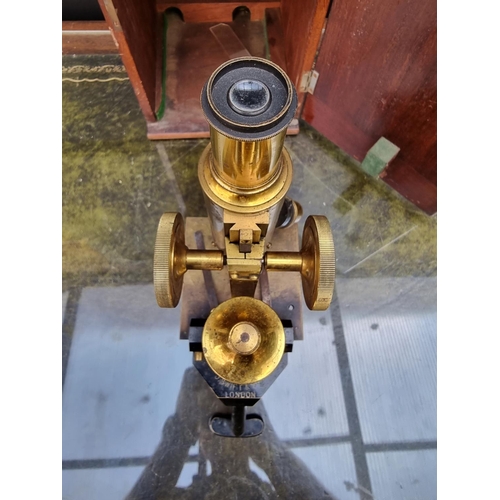 1297 - An old brass microscope, by J Swift & Sons, No.11993, in mahogany box. 