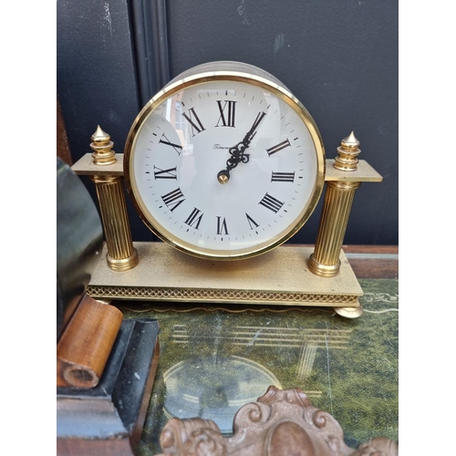 1298 - An Art Deco oak and inlaid mantel clock, the silvered chapter ring inscribed 'Garrard', 21cm high, w... 