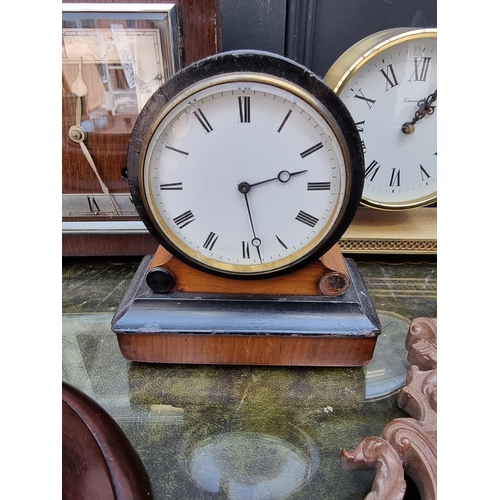 1298 - An Art Deco oak and inlaid mantel clock, the silvered chapter ring inscribed 'Garrard', 21cm high, w... 