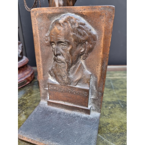 1303 - A pair of cast metal 'Charles Dickens' bookends, each stamped 'Bron Met', 15.5cm high; together with... 