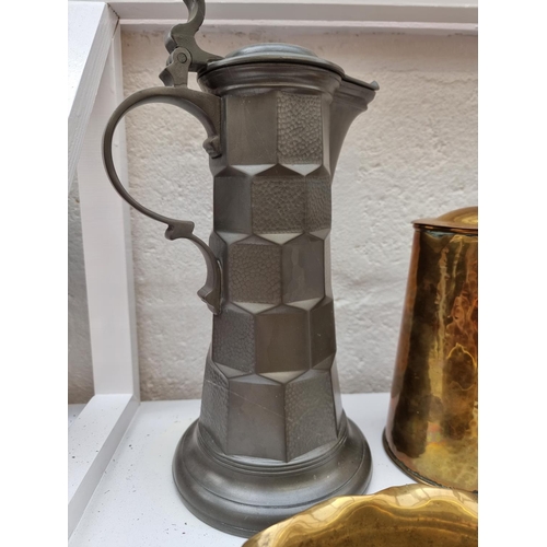 1334 - A collection of pewter and brass, to include Kayserzinn, largest 33cm. (6)