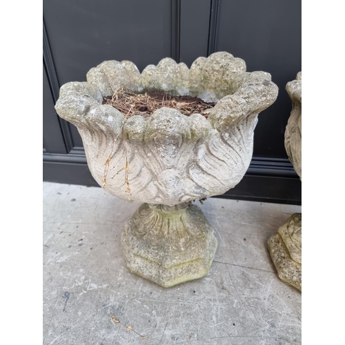 1349 - A set of three composition stone pedestal planters, 60cm high.