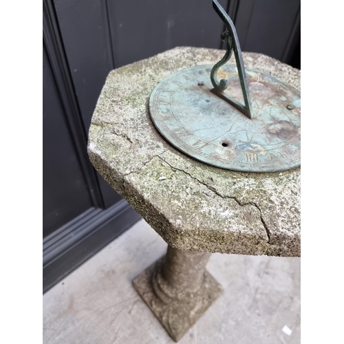 1352 - An old composition stone sundial, total height 84cm. 