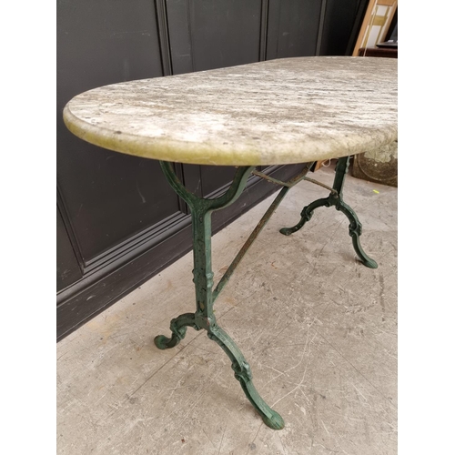 1358 - A marble top and cast iron base table, 119.5cm wide.