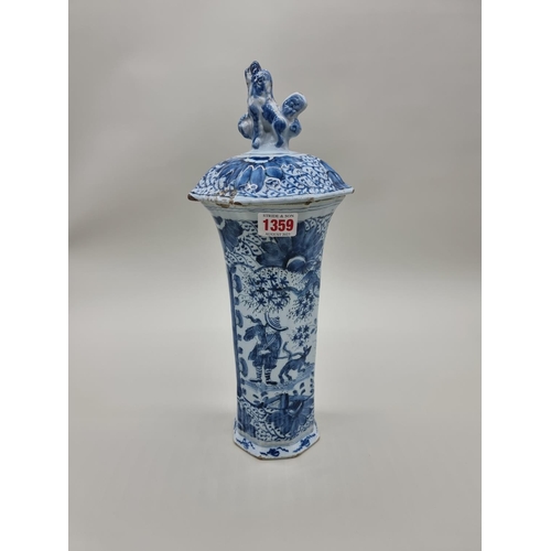 1359 - A tin glazed pottery delftware vase and cover, 18th/19th century, painted with a Chinese figure, 35.... 