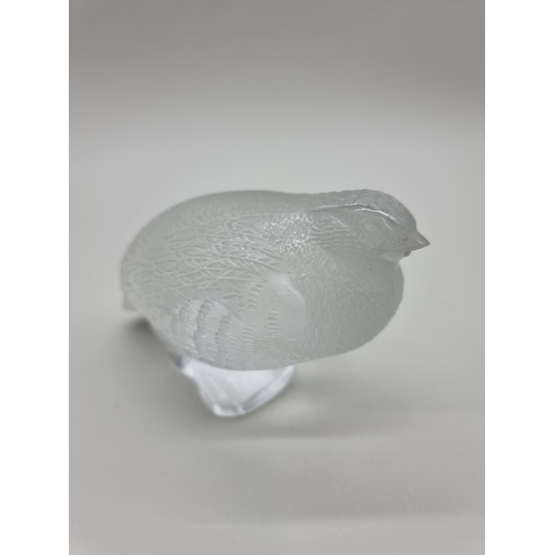 1365 - A Lalique 'Perdrix Couchee' frosted glass figure, 15.5cm long, (chip to beak).... 