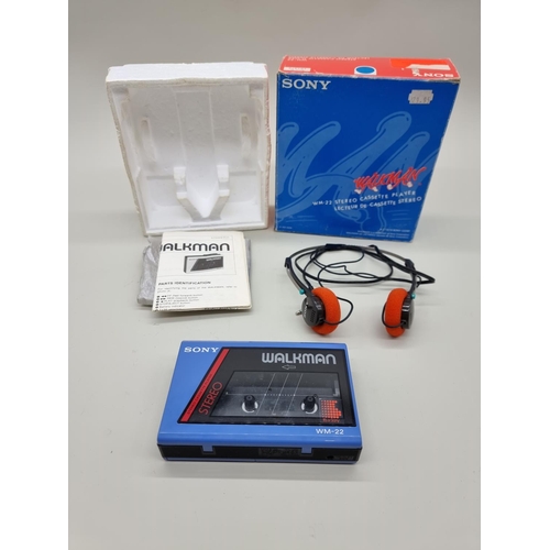 1377 - A blue Sony Walkman WM-22, boxed with headphones and instructions. 