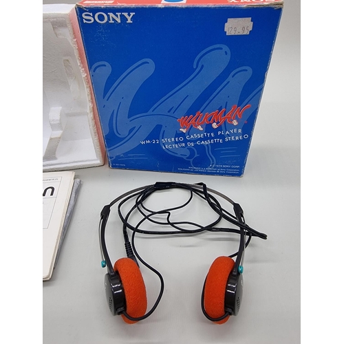 1377 - A blue Sony Walkman WM-22, boxed with headphones and instructions. 