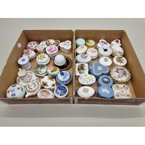 1378 - A collection of small porcelain boxes and covers.