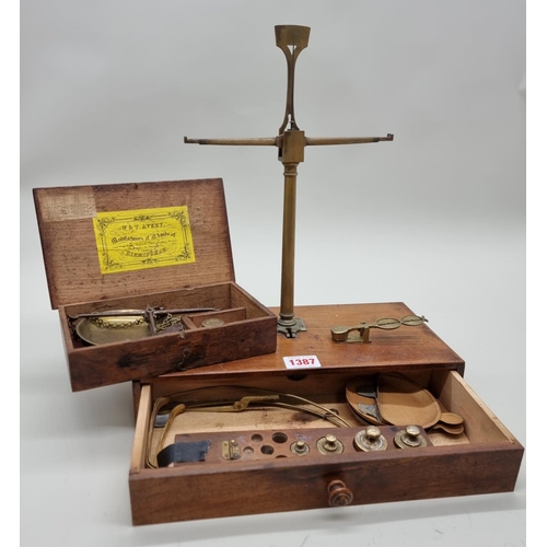 1387 - A 19th century oak cased set of balance scales, labelled W & T Avery, with weights; togethe... 