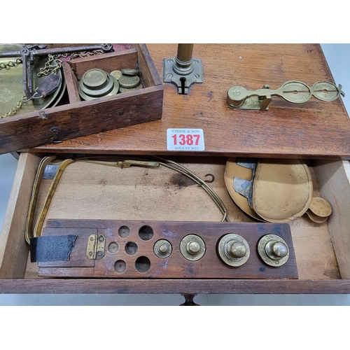 1387 - A 19th century oak cased set of balance scales, labelled W & T Avery, with weights; togethe... 