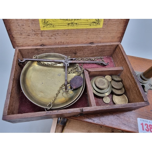 1387 - A 19th century oak cased set of balance scales, labelled W & T Avery, with weights; togethe... 