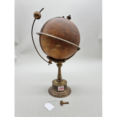 1389 - A scarce early 20th century globe timepiece, inscribed 'The Empire Clock', 39cm high, (faults).... 