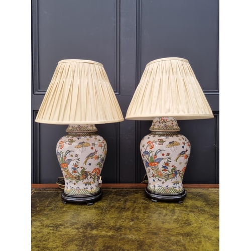 1424 - A pair of Chinese crackle glaze vase form table lamps, total height 65cm.