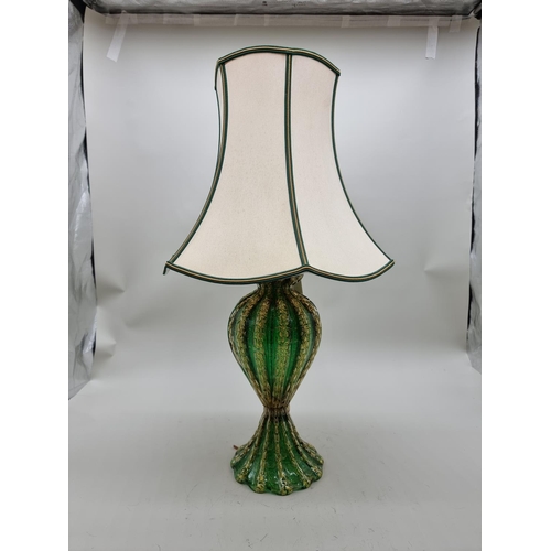 1429 - A Venetian green and gilt glass table lamp, height including shade 64cm. 