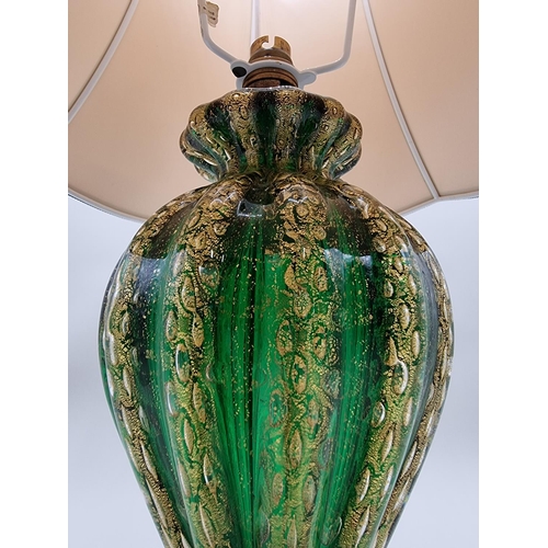 1429 - A Venetian green and gilt glass table lamp, height including shade 64cm. 