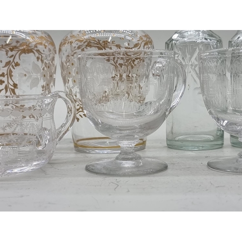 1439 - A small group of antique glass, to include a pair of etched and gilt bottles and stoppers, 19.5... 