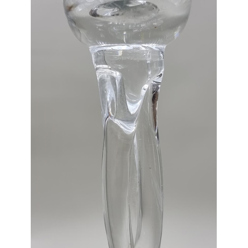 1452 - A pair of oversize clear glass candle holders, 50cm high. 