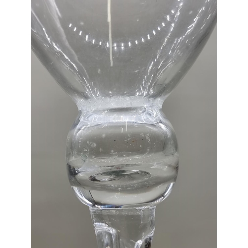 1452 - A pair of oversize clear glass candle holders, 50cm high. 