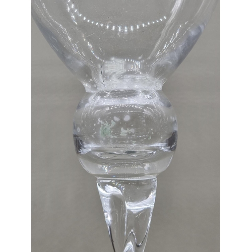 1452 - A pair of oversize clear glass candle holders, 50cm high. 