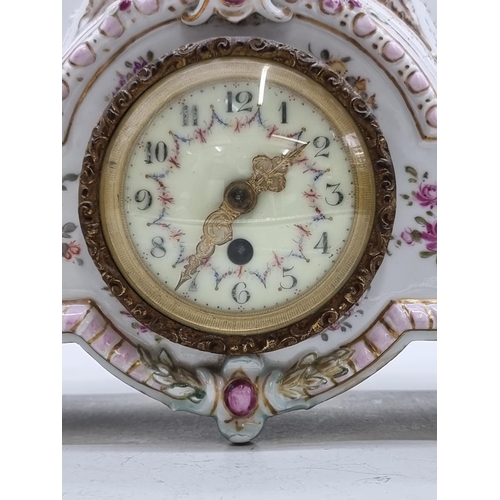 1454 - A Continental porcelain mantel timepiece, 37cm high.