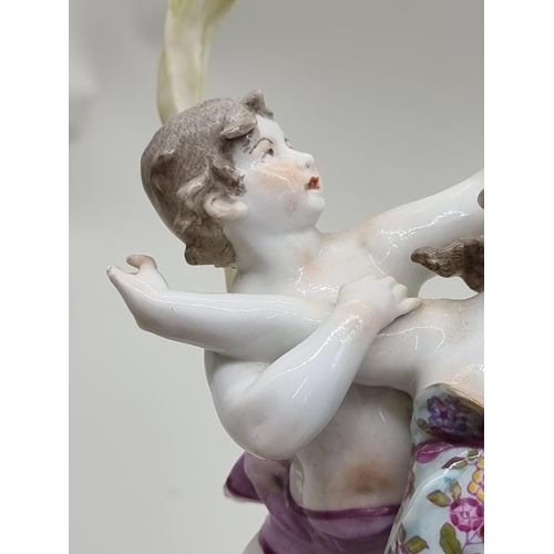 1454 - A Continental porcelain mantel timepiece, 37cm high.