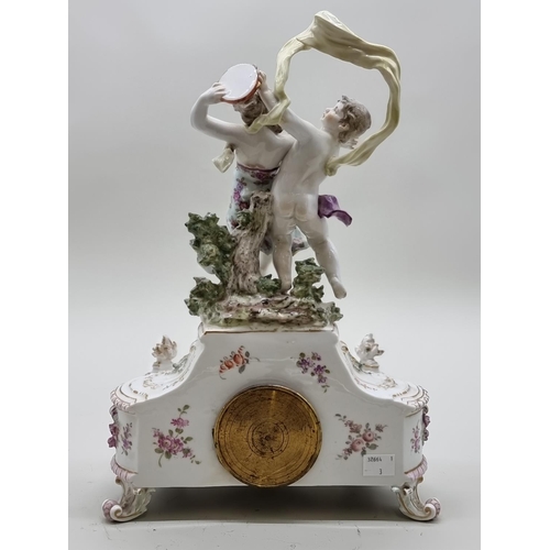 1454 - A Continental porcelain mantel timepiece, 37cm high.