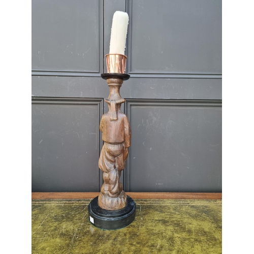 1461 - A carved wood figural candlestick, total height 56.5cm. 