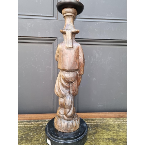 1461 - A carved wood figural candlestick, total height 56.5cm. 