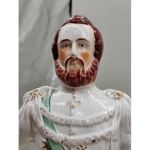 1469 - A large pair of early 20th century Staffordshire pottery figures of Queen Victoria and 'Prince of Wa... 