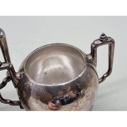 1474 - An antique plated metal three piece teaset, the teapot 19cm high. 