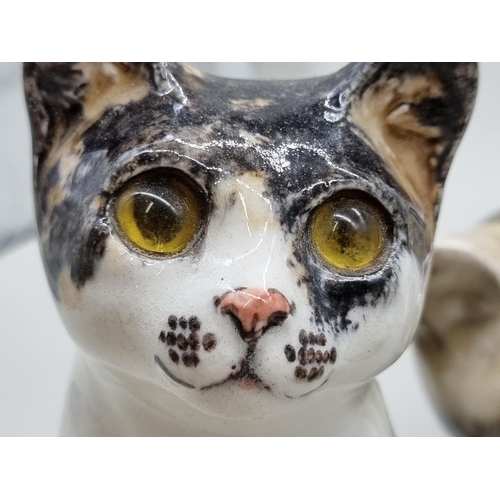 1486 - Studio Pottery: four pottery cats, by Jenny Winstanley, largest 28.5cm long. ... 