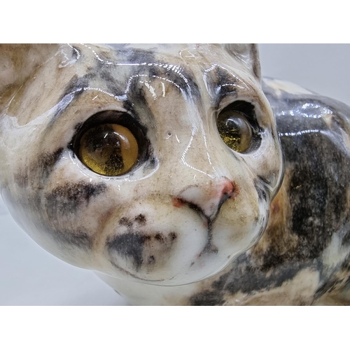 1486 - Studio Pottery: four pottery cats, by Jenny Winstanley, largest 28.5cm long. ... 