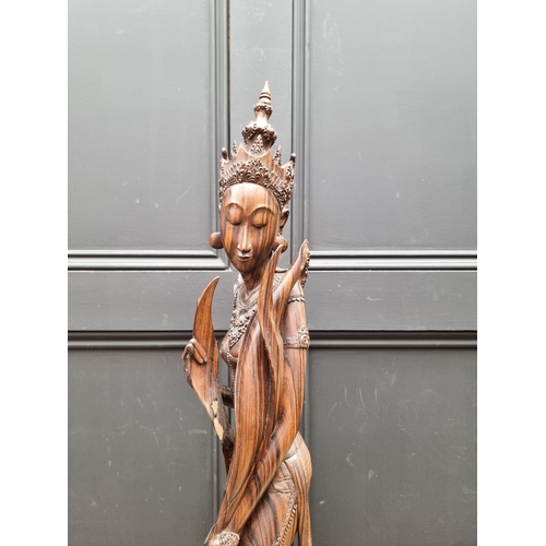 1497 - A large Balinese carved hardwood figure, 72cm high. 