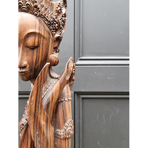 1497 - A large Balinese carved hardwood figure, 72cm high. 