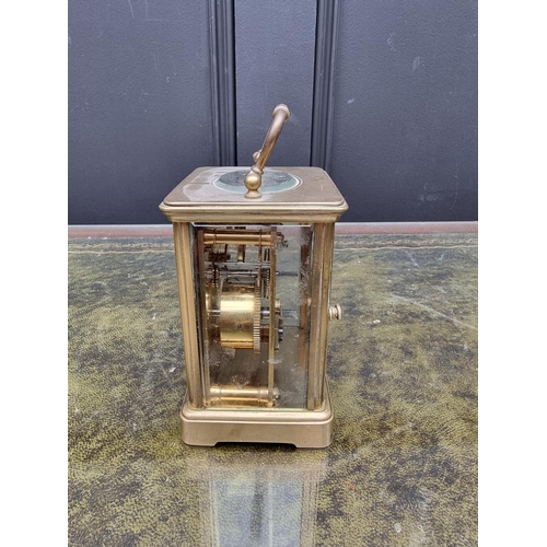 1517 - An old brass carriage timepiece, height including handle 14.5cm. 