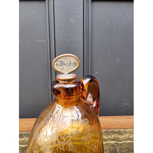 1543 - A Victorian amber glass whisky jug and mother of pearl stopper, with etched registration lozenge, he... 