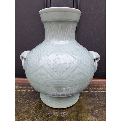 1546 - A large Chinese celadon twin handled vase, seal mark to base, 26.5cm high; together with a simi... 