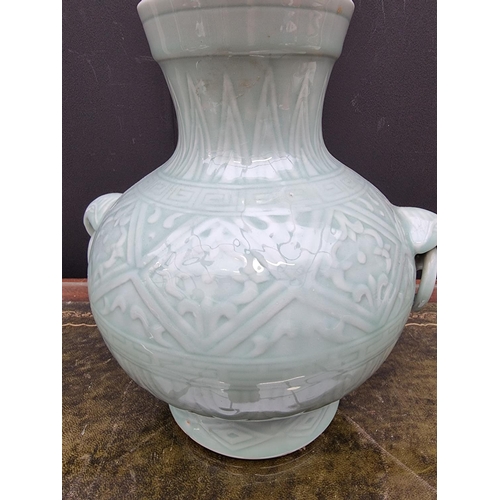 1546 - A large Chinese celadon twin handled vase, seal mark to base, 26.5cm high; together with a simi... 