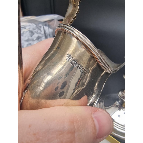 100 - A Georgian style silver milk jug, by George Nathan & Ridley Hayes, Chester 1909, 9cm high, 57g; ... 