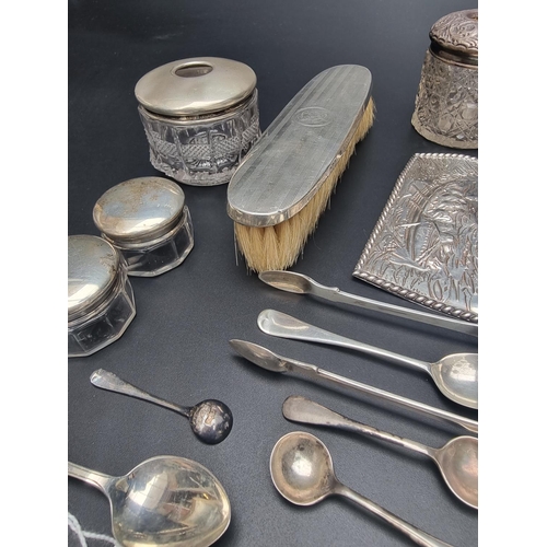 102 - A group of silver, to include cutlery; dressing table accessories; and a silver book cover, 175g wei... 