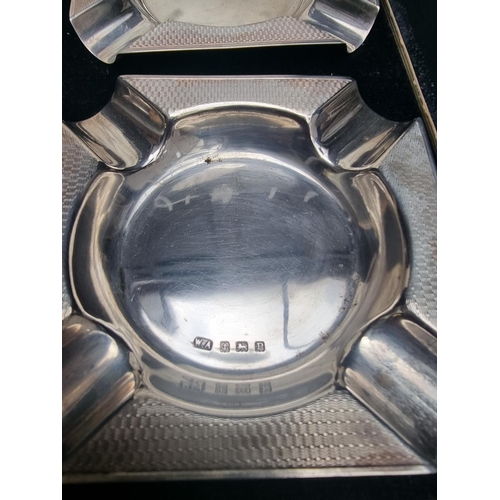 107 - A cased set of four silver ashtrays, by William Adams Ltd, London 1939, 191g.