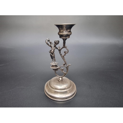 115 - A 19th century Continental candlestick, stamped '800', 9.5cm high; together with a silver napkin rin... 