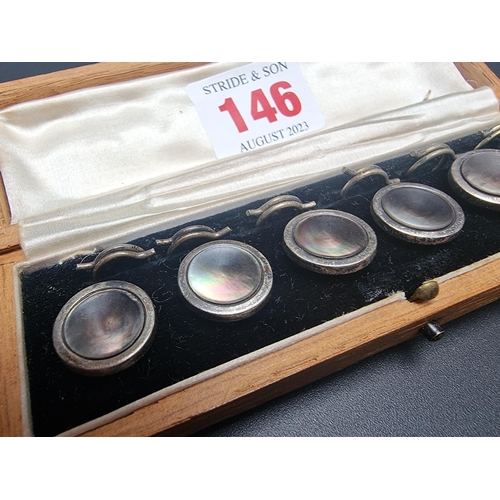 146 - An oak cased set of six silver and mother of pearl buttons, by J Aitkin & Son, 14mm diameter.... 