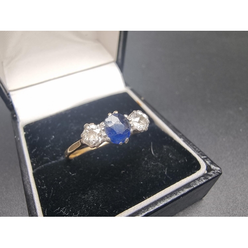 155 - A yellow metal sapphire and diamond three stone ring, set facetted sapphire and two old cut diamonds... 