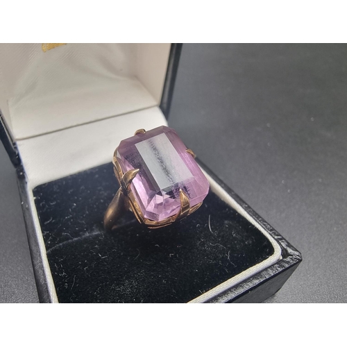 156 - A yellow metal amethyst ring, stamped, size L 1/2.