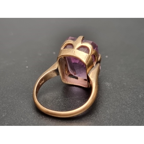 156 - A yellow metal amethyst ring, stamped, size L 1/2.